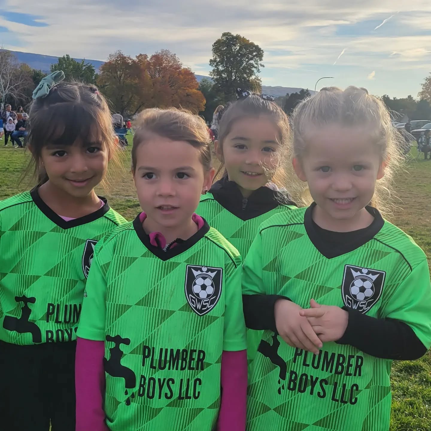 Plumber Boys LLC sponsored youth soccer team in green jerseys